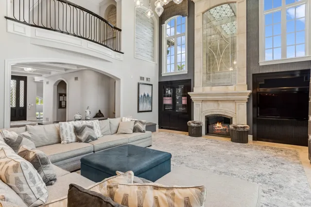 a view of a dining room with a table and chairs