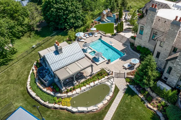 an aerial view of a house with outdoor space