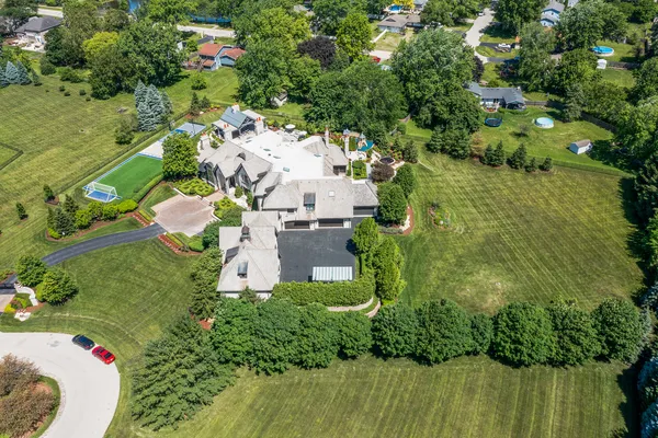 a view of a house with a yard and garage