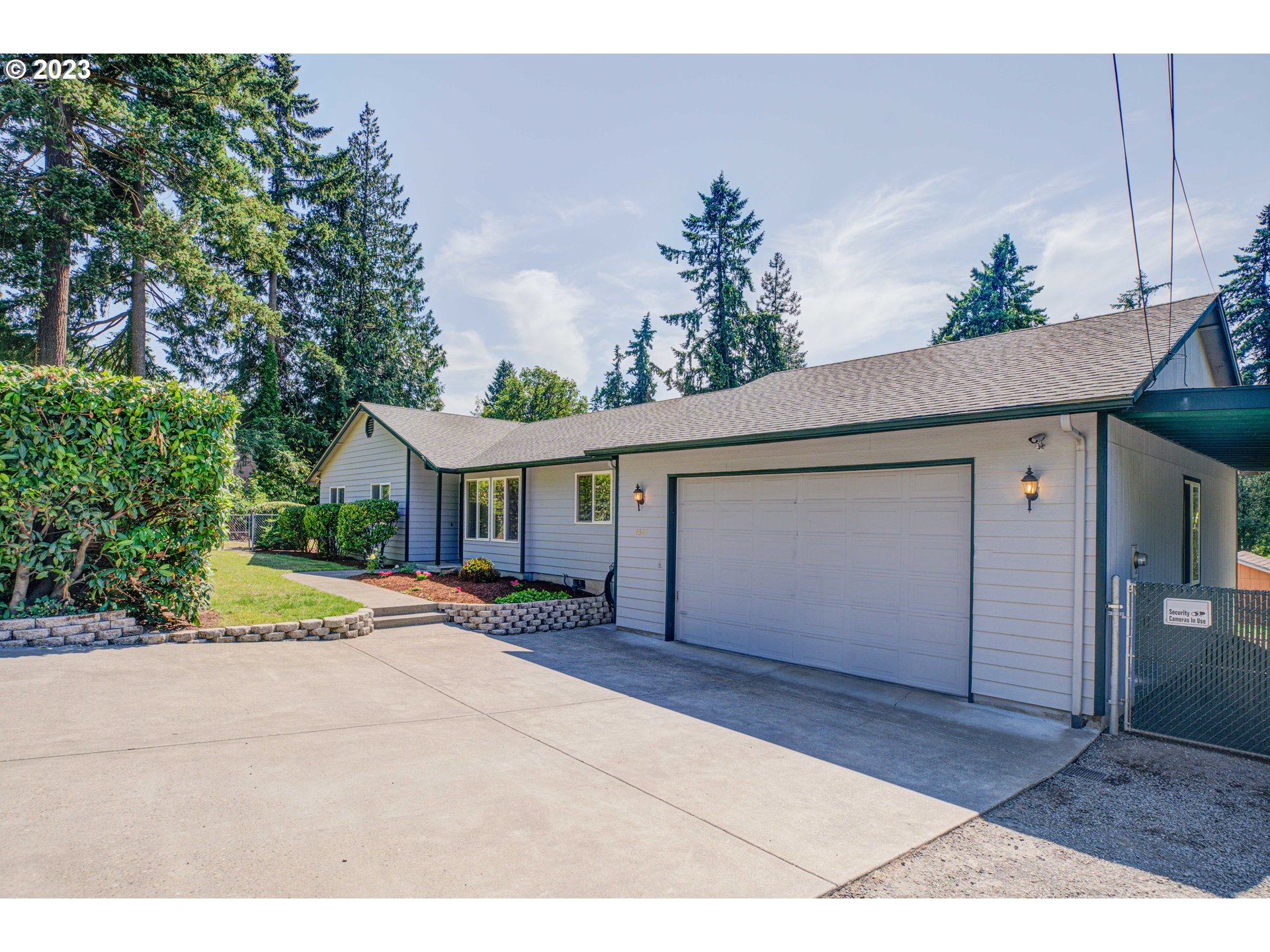 a front view of a house with a yard and a garage