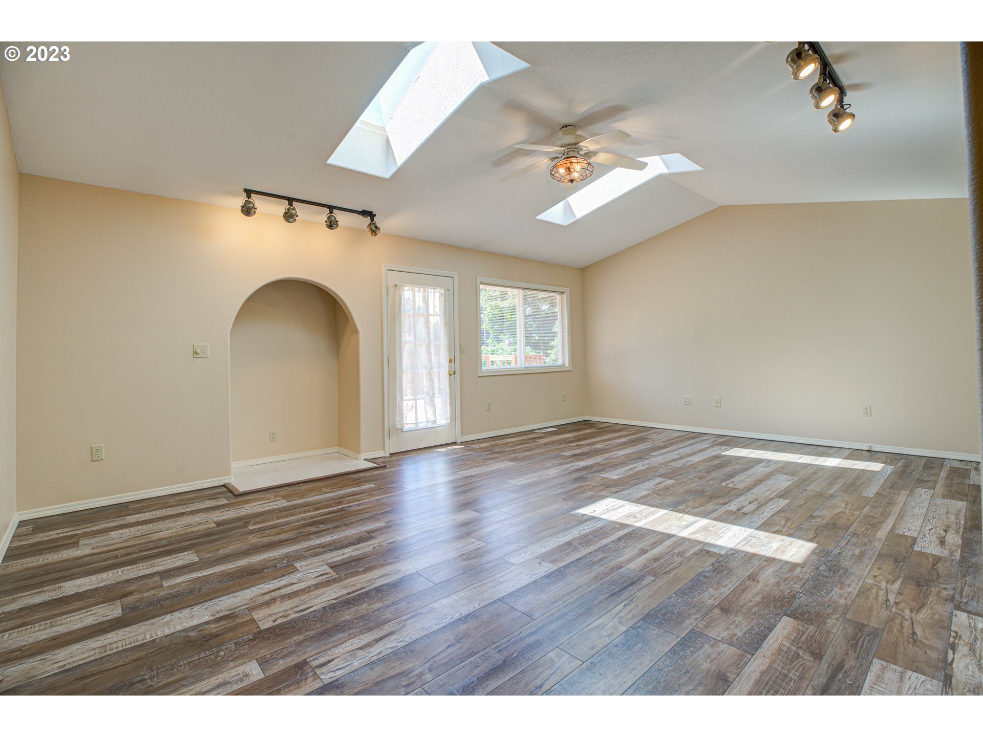 4523 Southeast Hill Road Milwaukie, OR 97267 - Photo 17 of 48 a view of empty room with wooden floor and fan