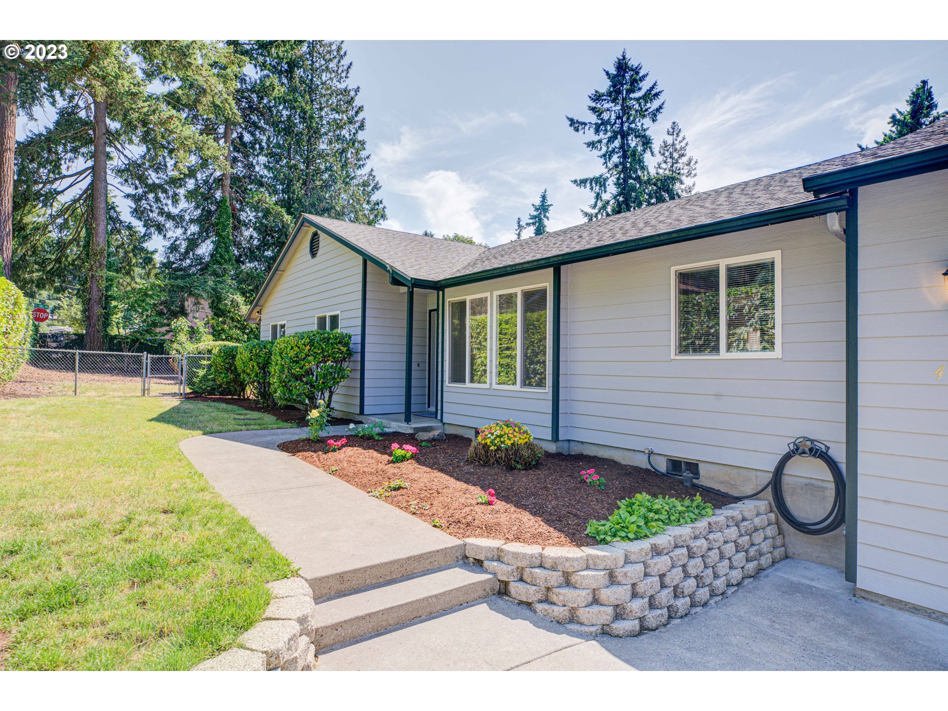 4523 Southeast Hill Road Milwaukie, OR 97267 - Photo 2 of 48 a front view of a house with garden