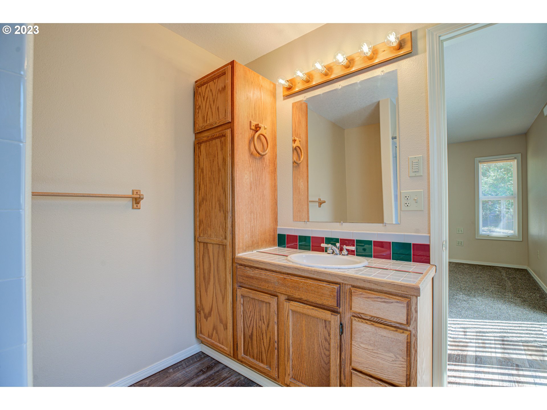4523 Southeast Hill Road Milwaukie, OR 97267 - Photo 29 of 48 a bathroom with a sink and a mirror