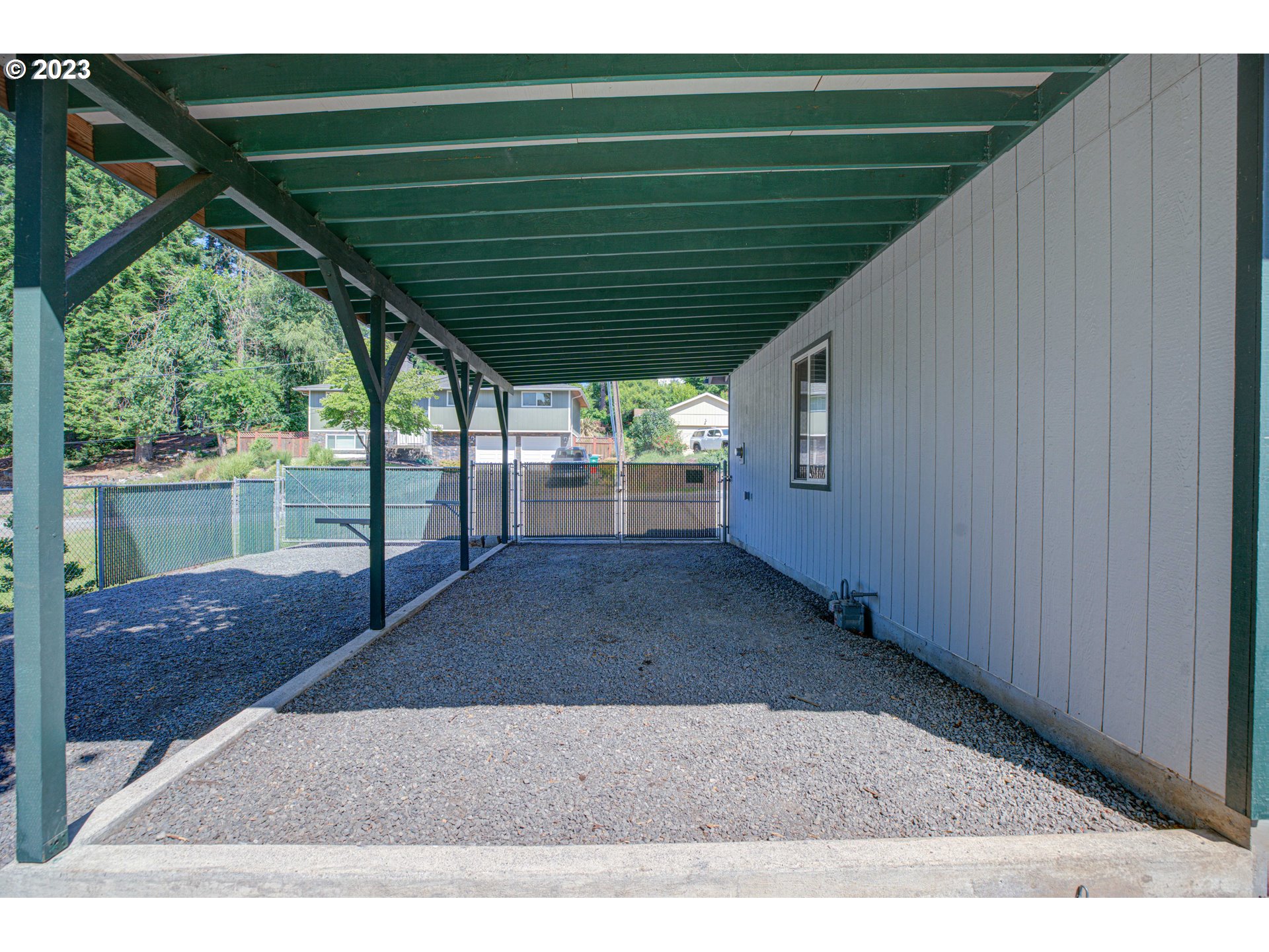 4523 Southeast Hill Road Milwaukie, OR 97267 - Photo 40 of 48 a backyard of a house with wooden floor and outdoor seating