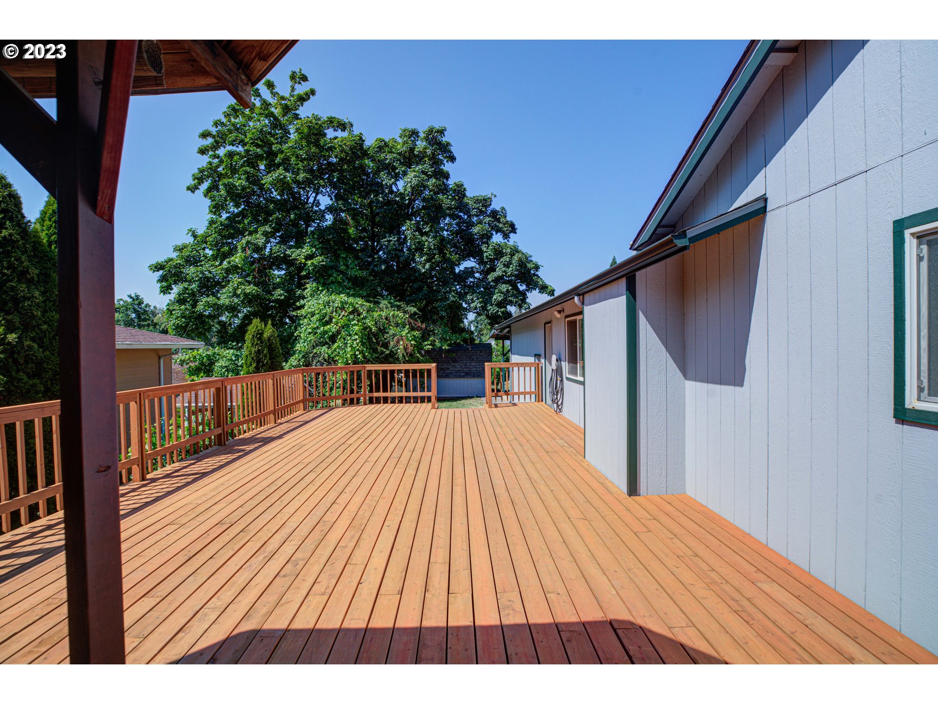 4523 Southeast Hill Road Milwaukie, OR 97267 - Photo 43 of 48 a view of backyard with a deck and wooden floor