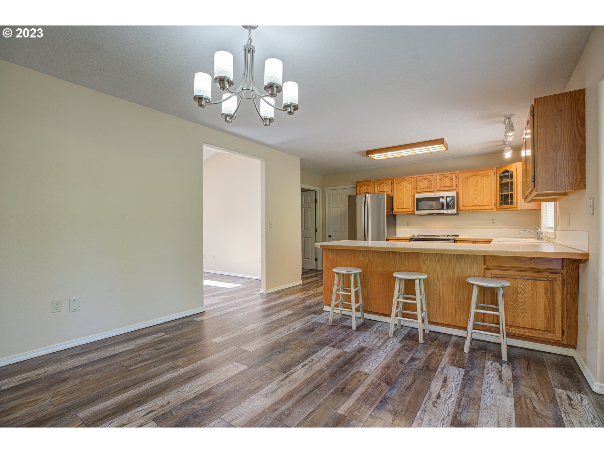 4523 Southeast Hill Road Milwaukie, OR 97267 - Photo 7 of 48 a view of kitchen with sink and wooden floor