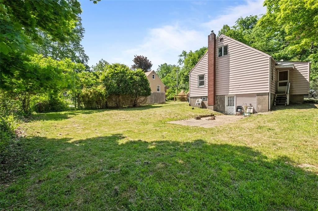 1012 Universal Road Pittsburgh, PA 15235 - Photo 13 of 13 a swimming pool with trees in the background