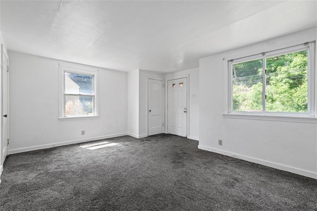 1012 Universal Road Pittsburgh, PA 15235 - Photo 2 of 13 a view of an empty room with a window