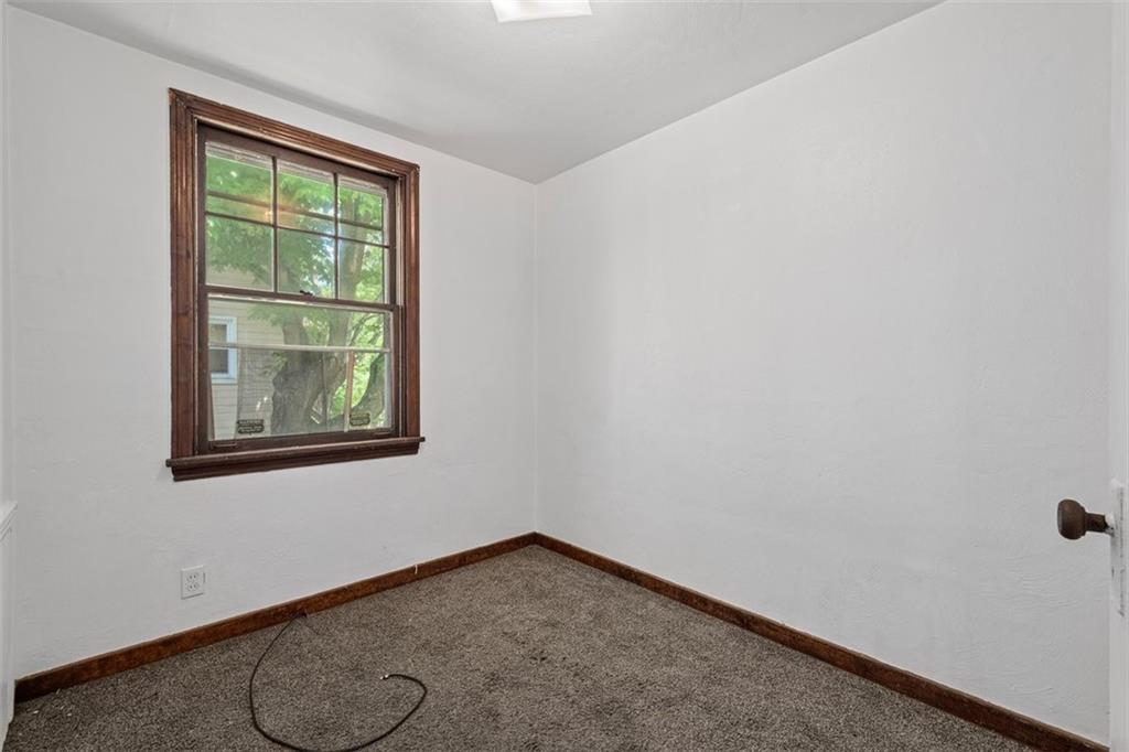 1012 Universal Road Pittsburgh, PA 15235 - Photo 7 of 13 an empty room with windows