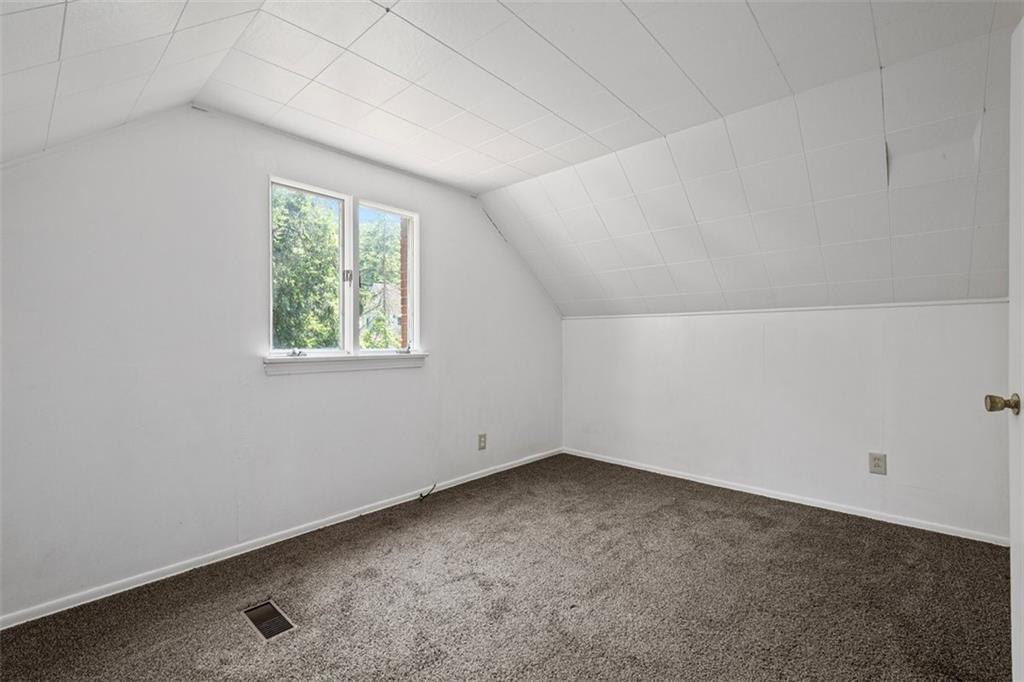 1012 Universal Road Pittsburgh, PA 15235 - Photo 8 of 13 an empty room with a window