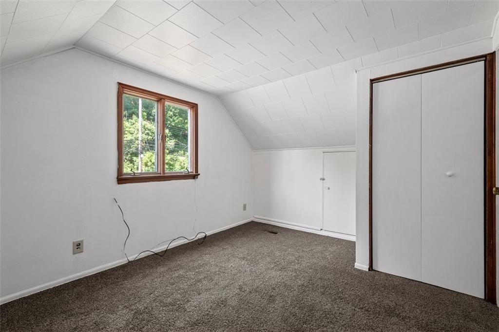 1012 Universal Road Pittsburgh, PA 15235 - Photo 9 of 13 an empty room with windows