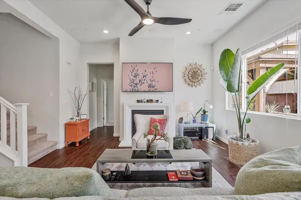 a bedroom with a bed and a lamp on dresser