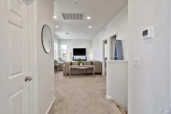 a spacious bathroom with a granite countertop sink mirror and bathtub