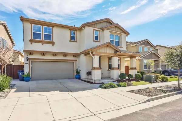 a view of a livingroom with workspace and a window