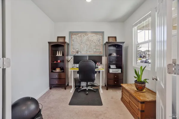 a view of kitchen with cabinets table and chairs