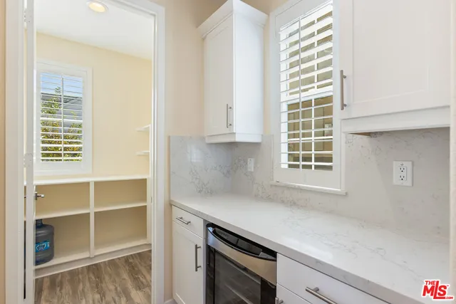 a kitchen with a sink and a window