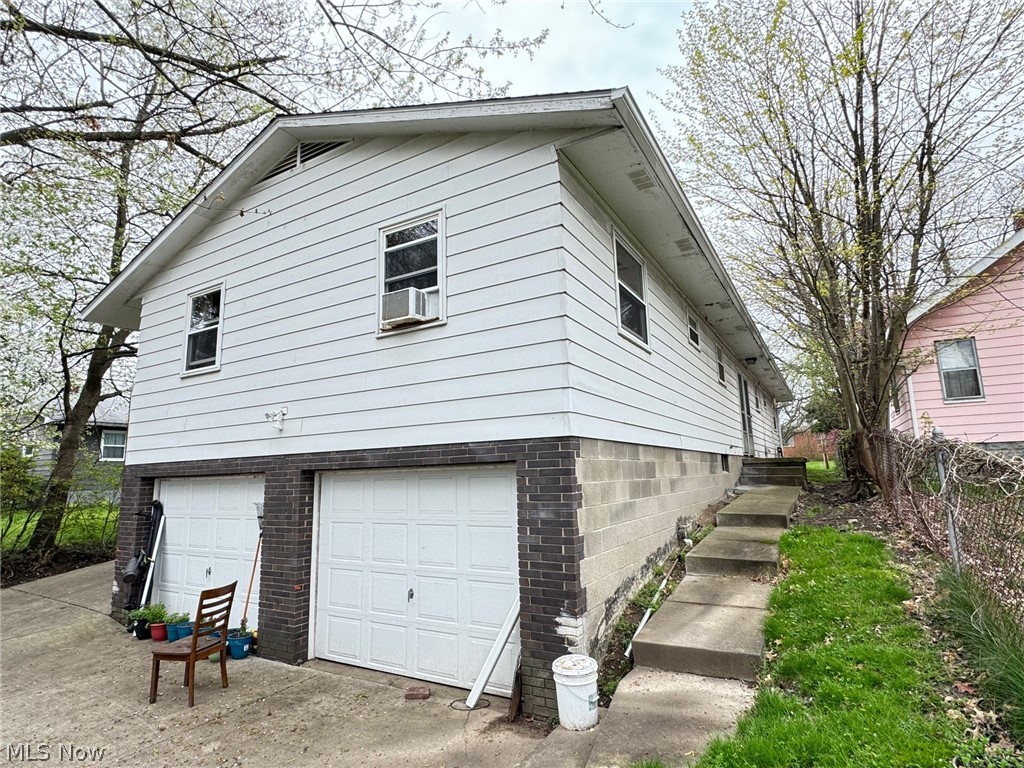View of side of home featuring a garage