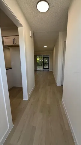 a kitchen with granite countertop a refrigerator and a sink