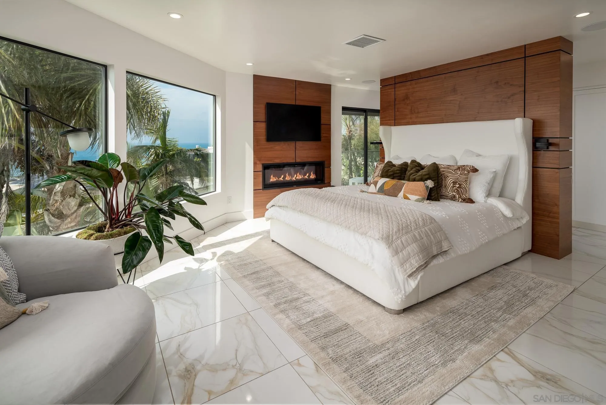 136 Verdi Avenue Cardiff, CA 92007 - Photo 11 of 27 a bedroom with a large bed and a flat screen tv