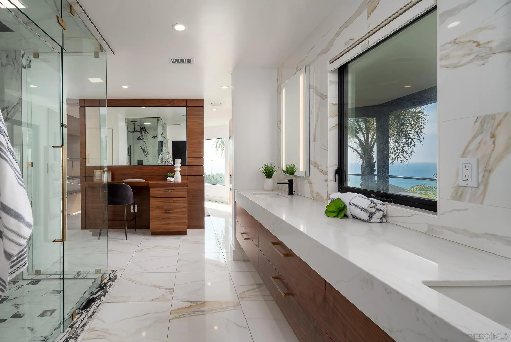 136 Verdi Avenue Cardiff, CA 92007 - Photo 15 of 27 a large bathroom with a double vanity sink a mirror and a shower