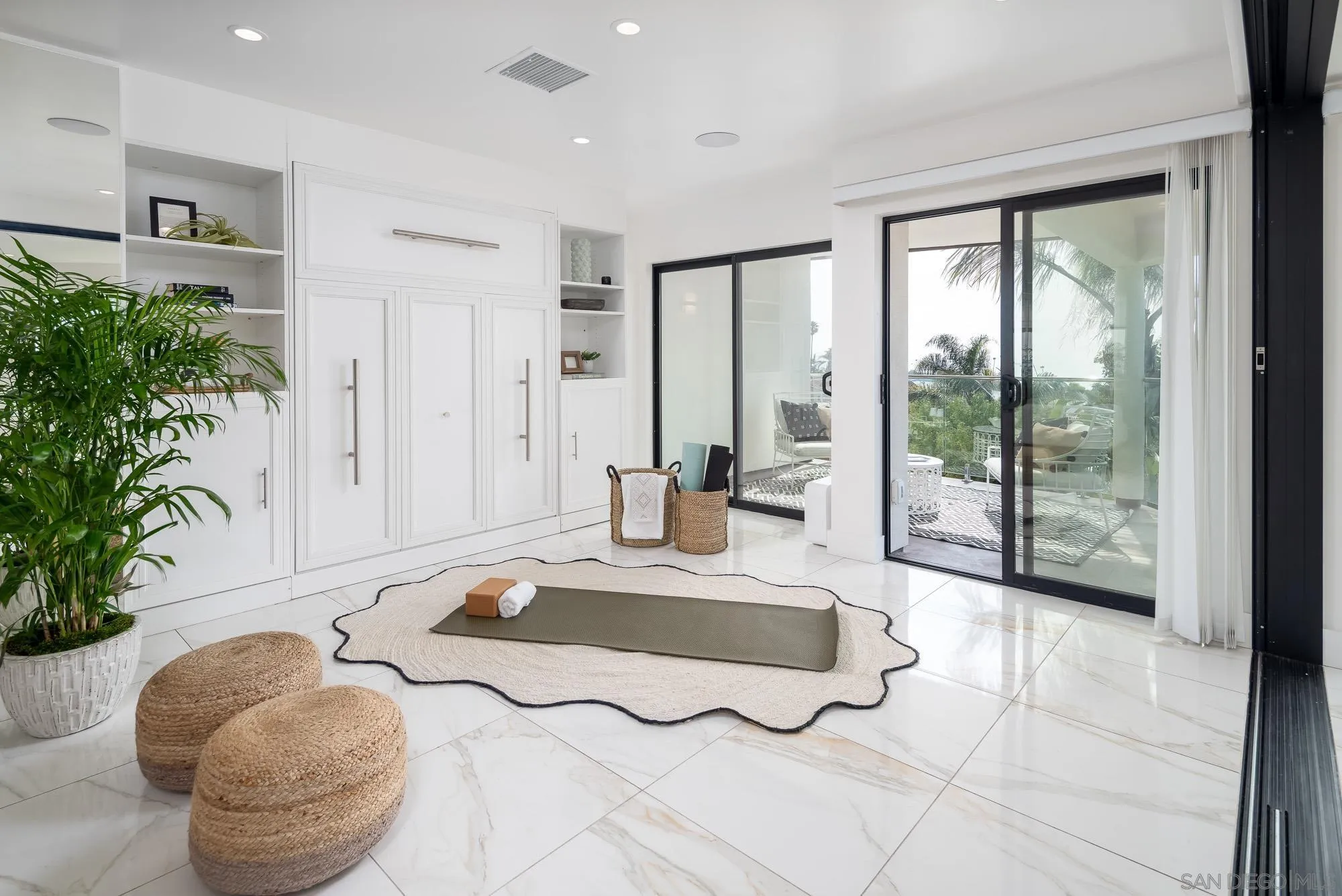 136 Verdi Avenue Cardiff, CA 92007 - Photo 17 of 27 a spacious bedroom with a large bed and a potted plant