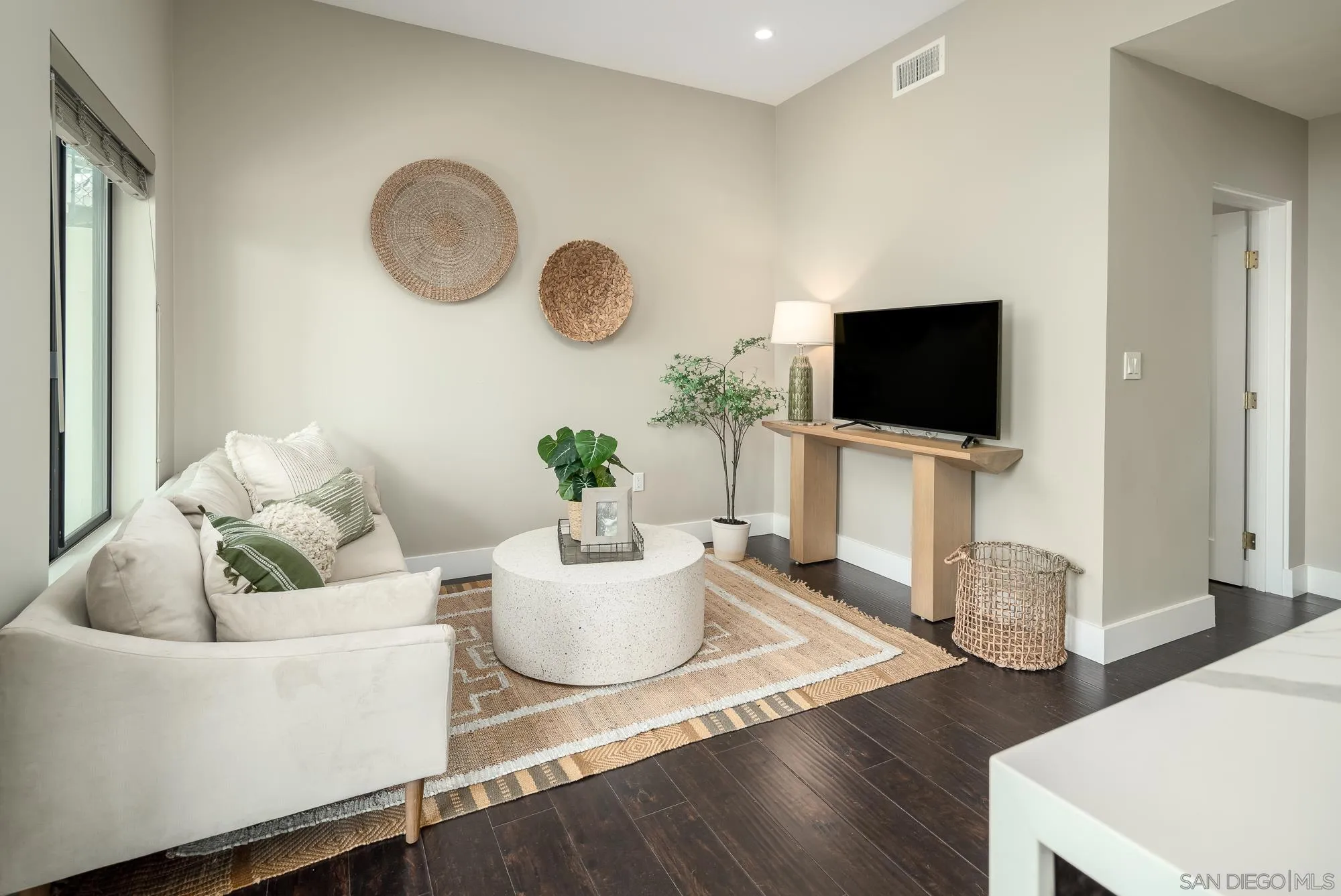 136 Verdi Avenue Cardiff, CA 92007 - Photo 22 of 27 a living room with furniture and a flat screen tv