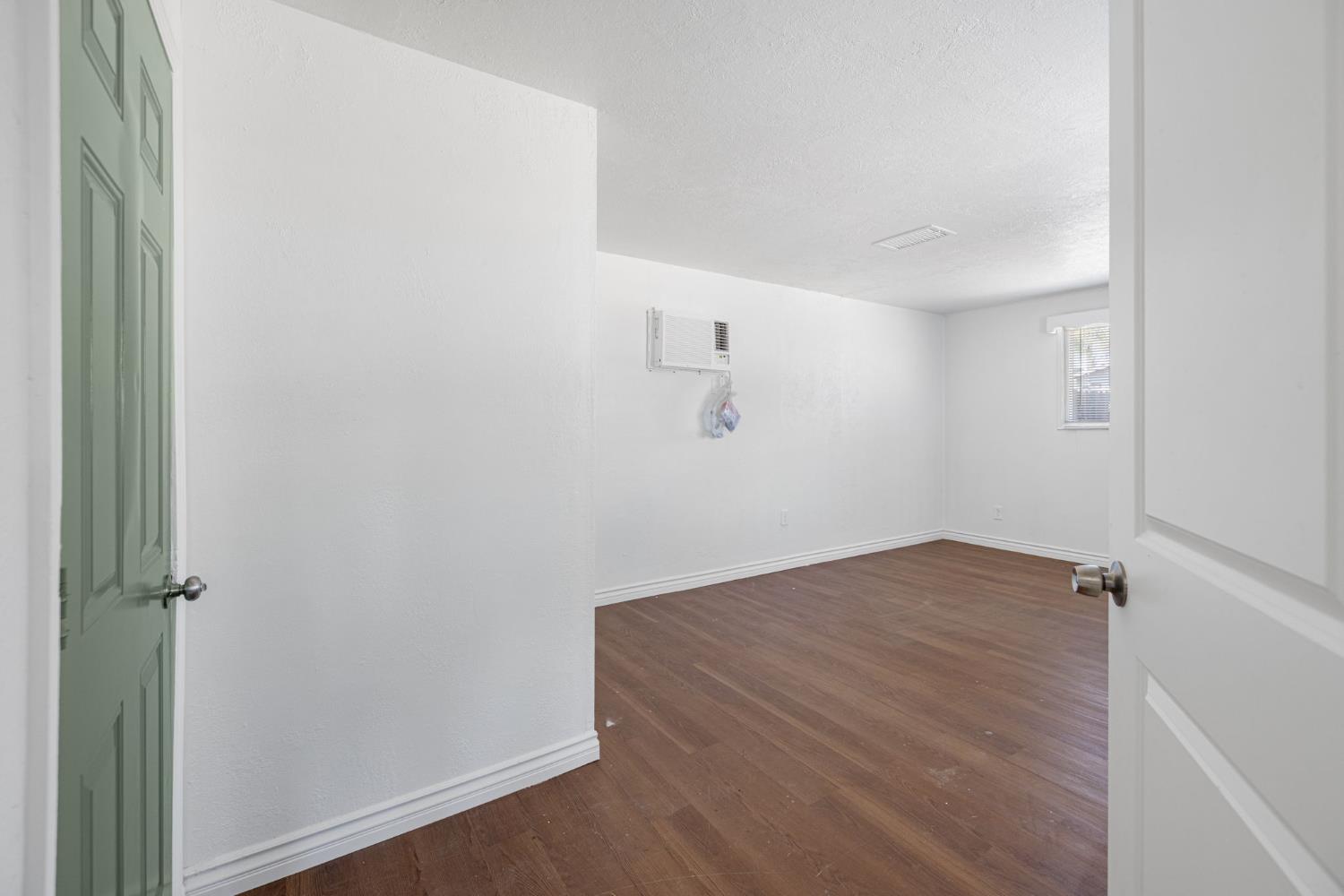 210 East Bush Street Lemoore, CA 93245 - Photo 20 of 42 an empty room with a workbench