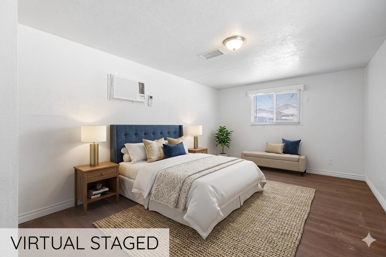 210 East Bush Street Lemoore, CA 93245 - Photo 22 of 42 a bedroom with a bed and a night stand