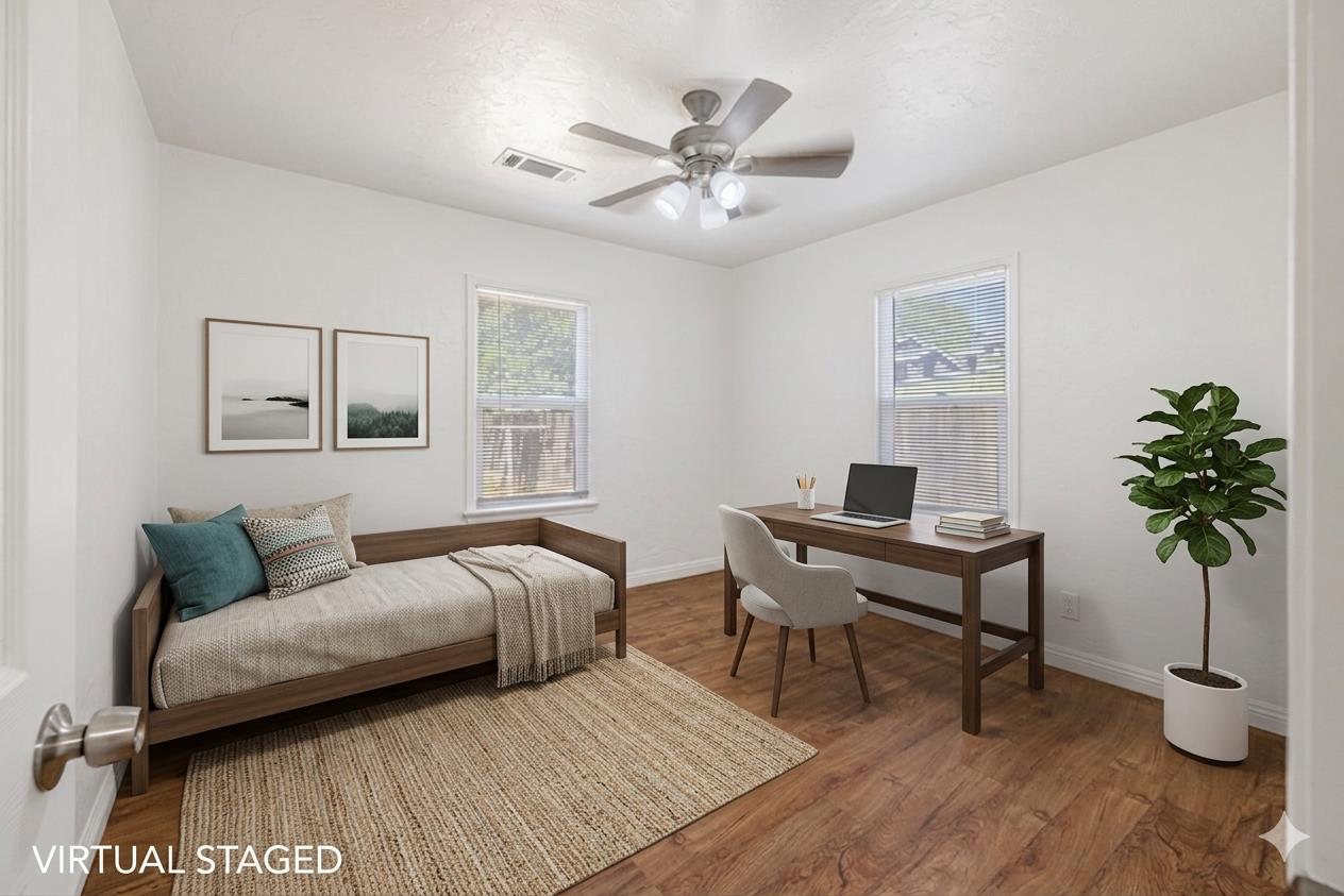 210 East Bush Street Lemoore, CA 93245 - Photo 29 of 42 a living room with furniture and a potted plant