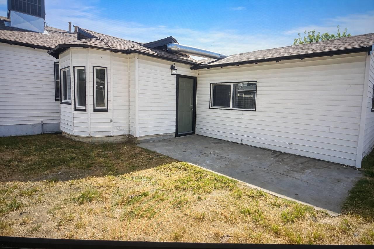 210 East Bush Street Lemoore, CA 93245 - Photo 37 of 42 a view of backyard of the house