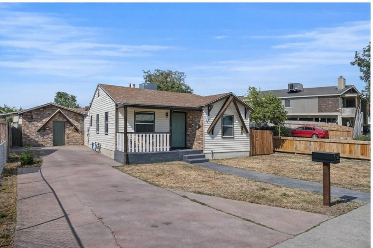 210 East Bush Street Lemoore, CA 93245 - Photo 42 of 42 a front view of a house with a yard