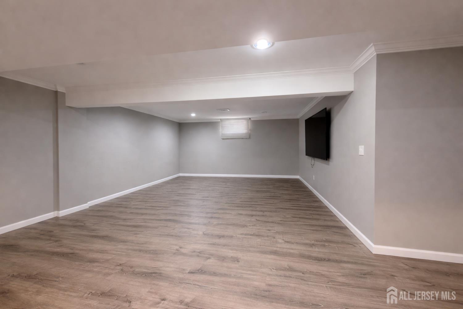 618 Lee Street Perth Amboy, NJ 08861 - Photo 20 of 24 a view of empty room with wooden floor