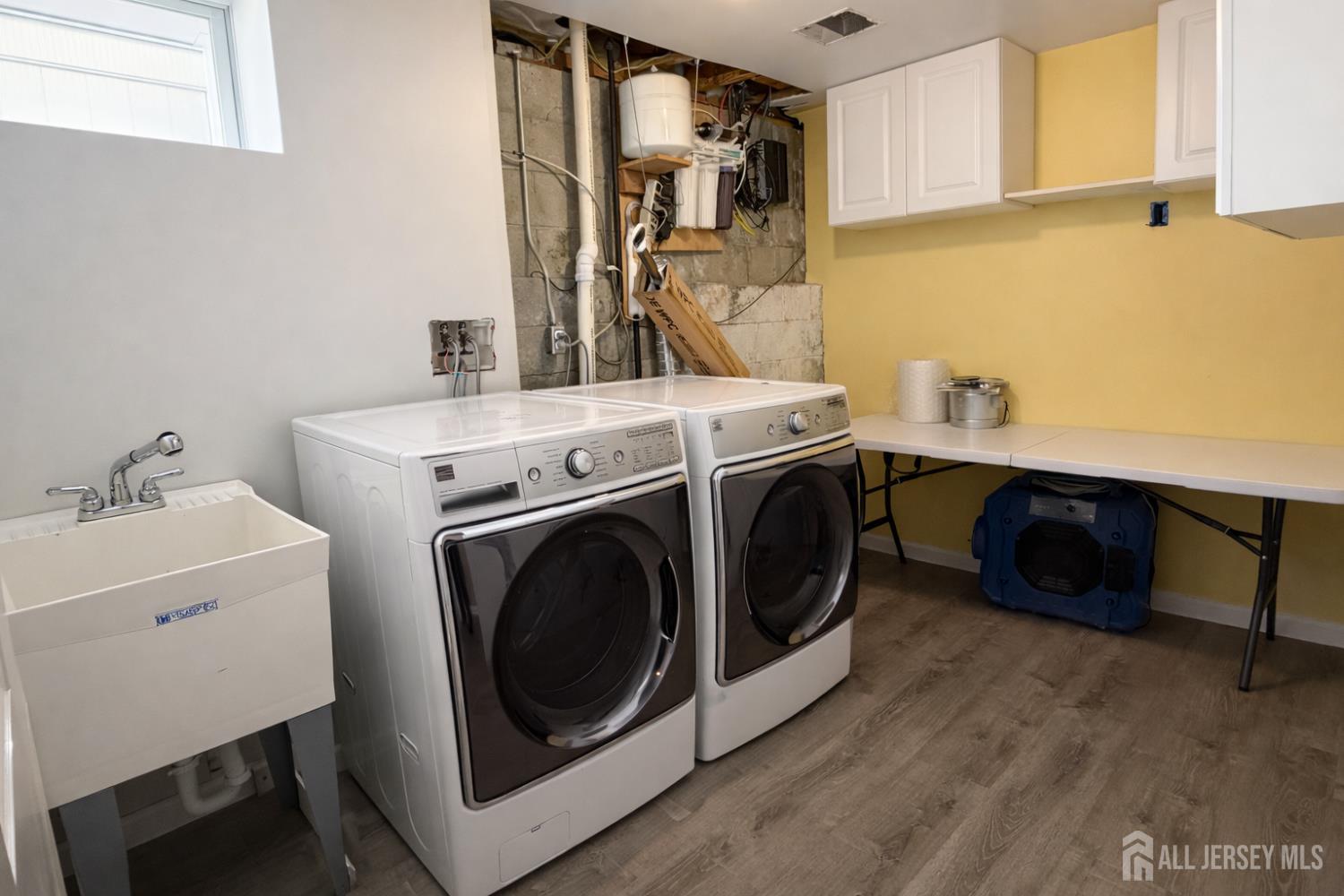 618 Lee Street Perth Amboy, NJ 08861 - Photo 21 of 24 a utility room with dryer and washer