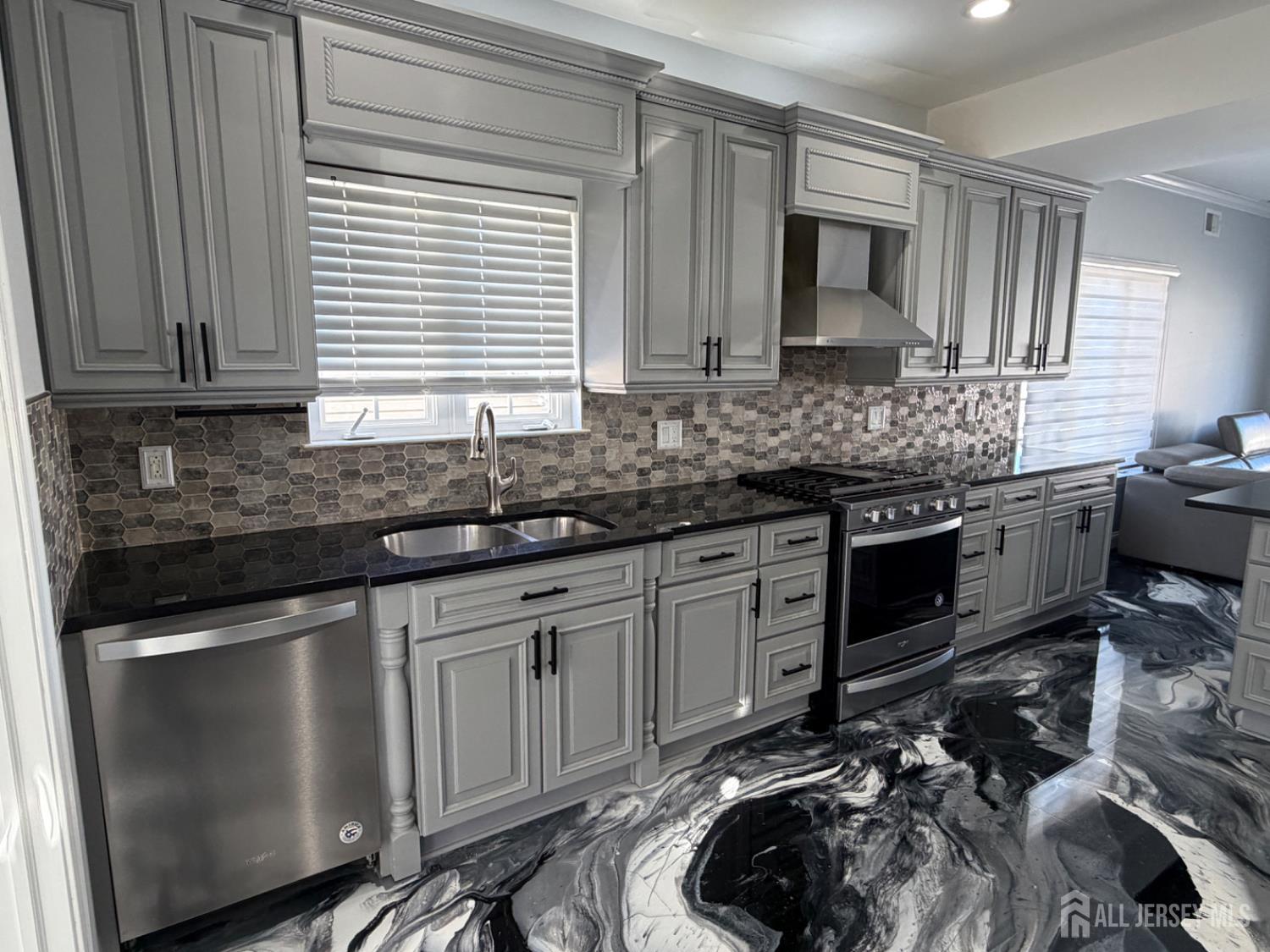 618 Lee Street Perth Amboy, NJ 08861 - Photo 5 of 24 a kitchen with stainless steel appliances granite countertop a sink stove and cabinets