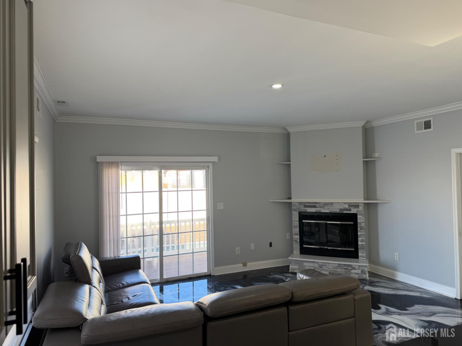 618 Lee Street Perth Amboy, NJ 08861 - Photo 8 of 24 a living room with furniture and a fireplace