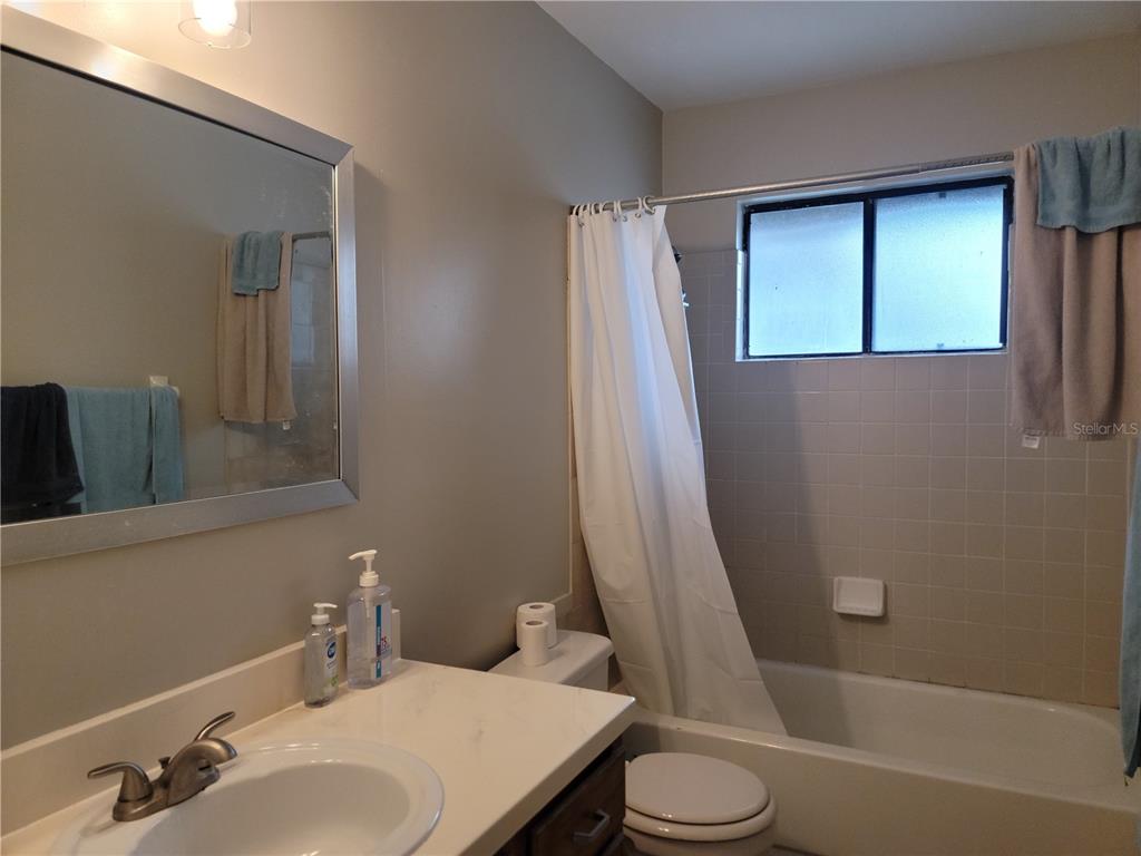 2300 Southwest 43rd Street, Unit I1 Gainesville, FL 32607 - Photo 14 of 15 a bathroom with a sink toilet and shower