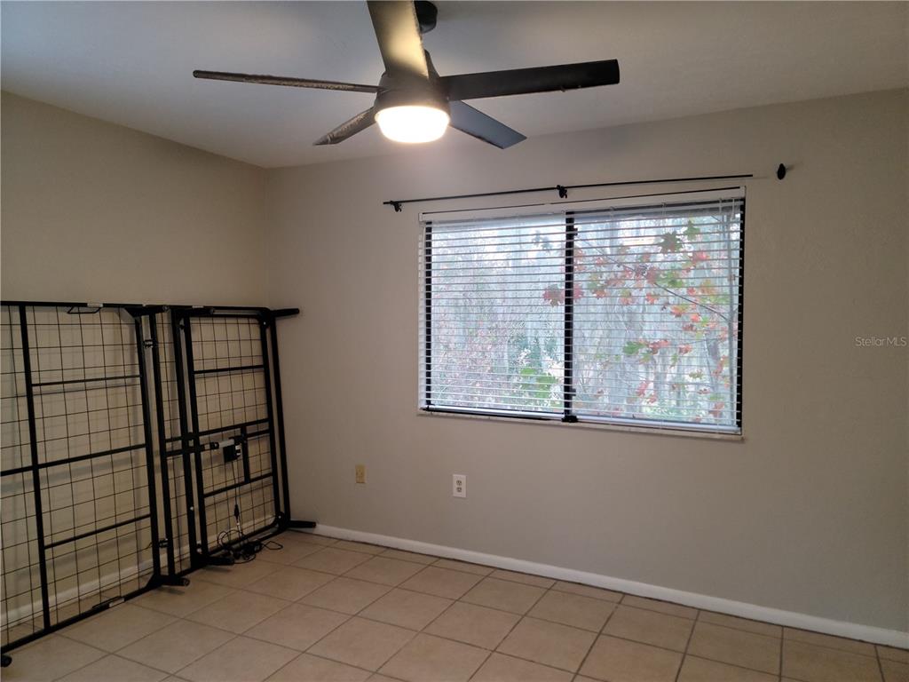 2300 Southwest 43rd Street, Unit I1 Gainesville, FL 32607 - Photo 15 of 15 a view of an empty room with a window