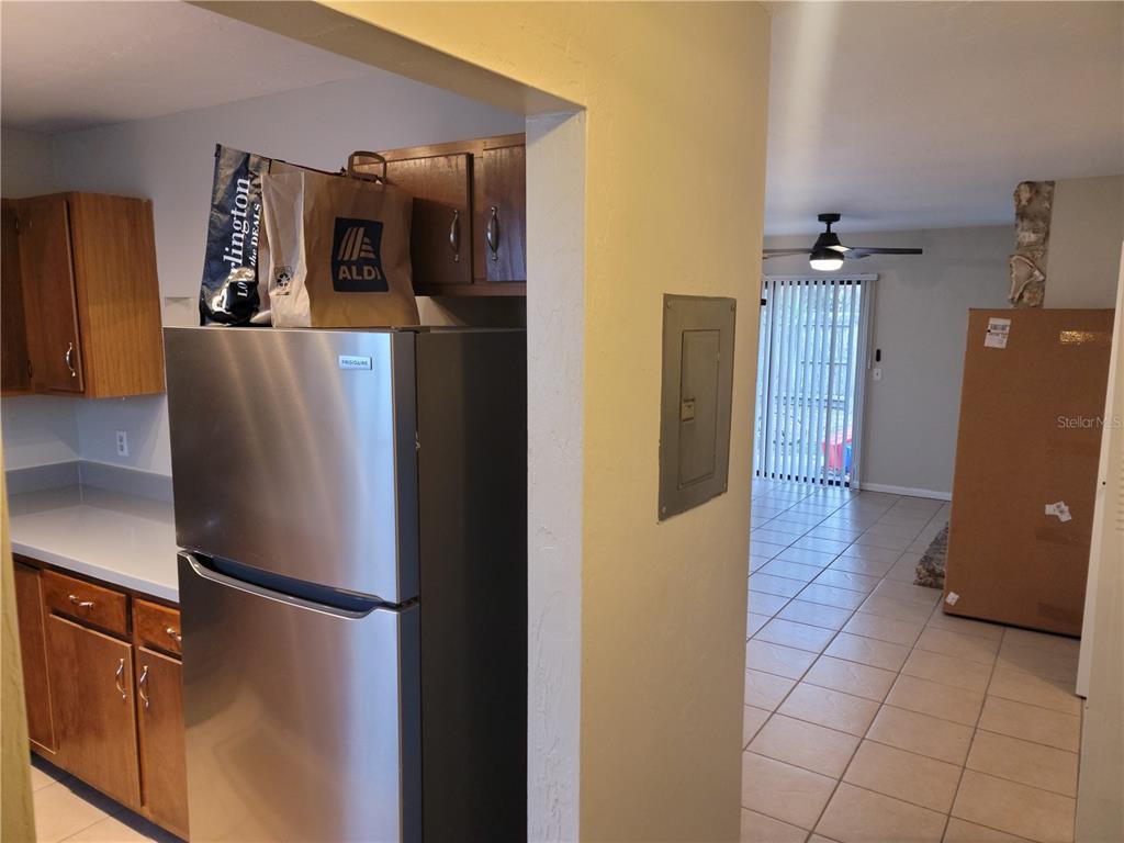 2300 Southwest 43rd Street, Unit I1 Gainesville, FL 32607 - Photo 2 of 15 a view of a refrigerator and an empty room