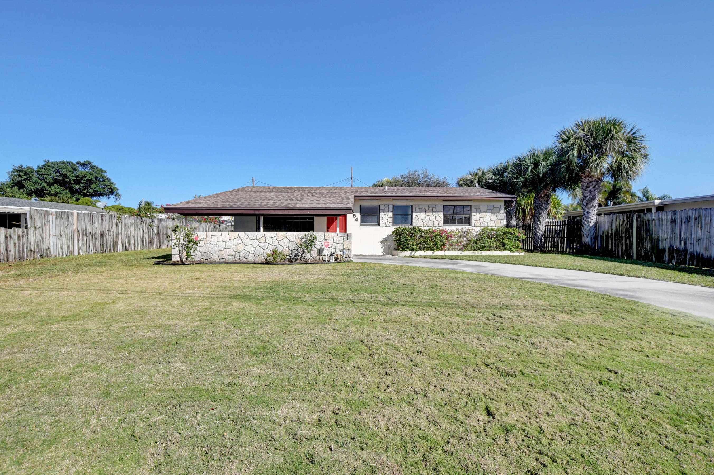 4554 Northeast 4th Avenue Boca Raton, FL 33431 - Photo 1 of 37 01_Beautiful green front yard