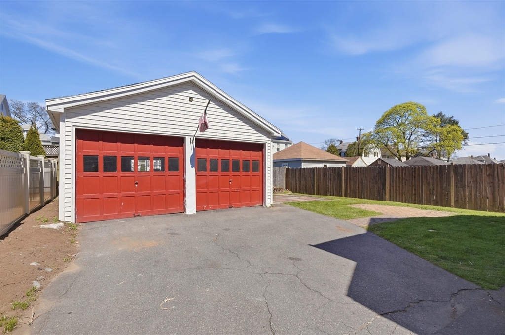 55 Addison Avenue Lynn, MA 01902 - Photo 3 of 23 a view of a house with backyard and a garage