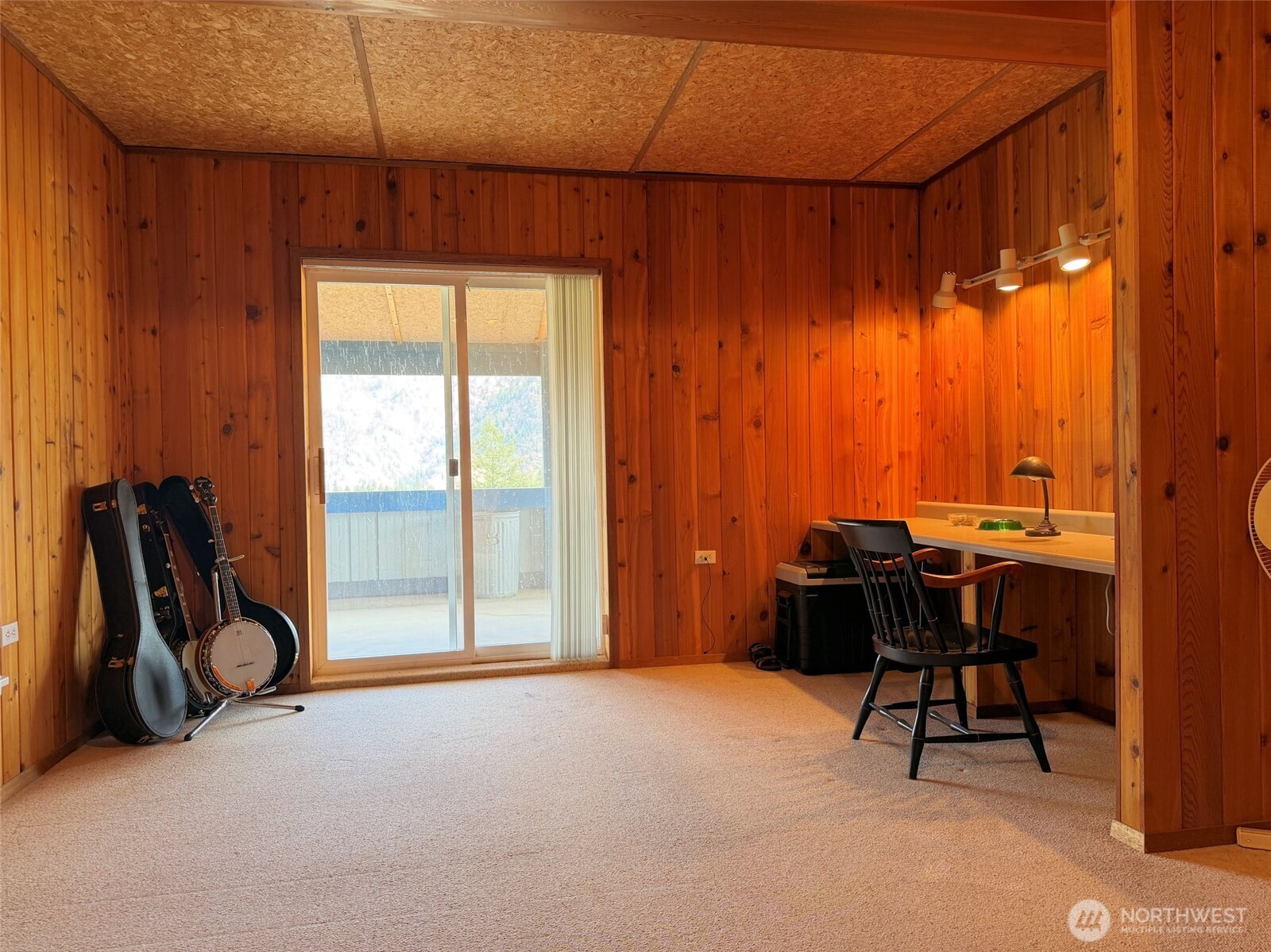 41238 Sterling Valley Road North Lincoln, WA 99147 - Photo 12 of 39 a view of a workspace with furniture and a window