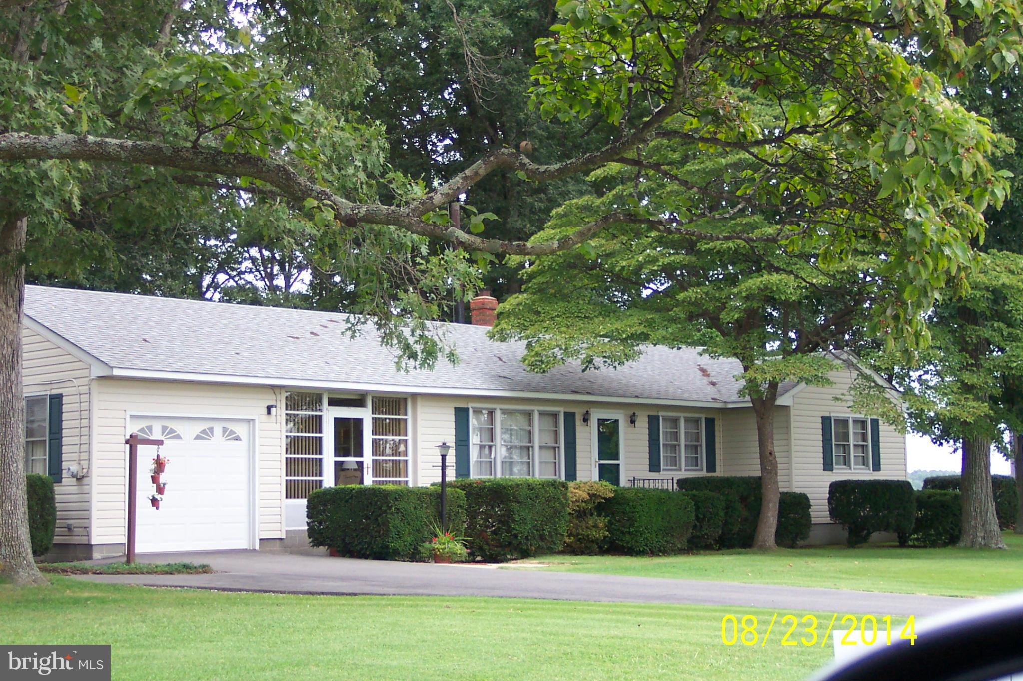 5884 Cloverdale Road Hurlock, MD 21643 - Photo 1 of 26 a front view of a house with a yard