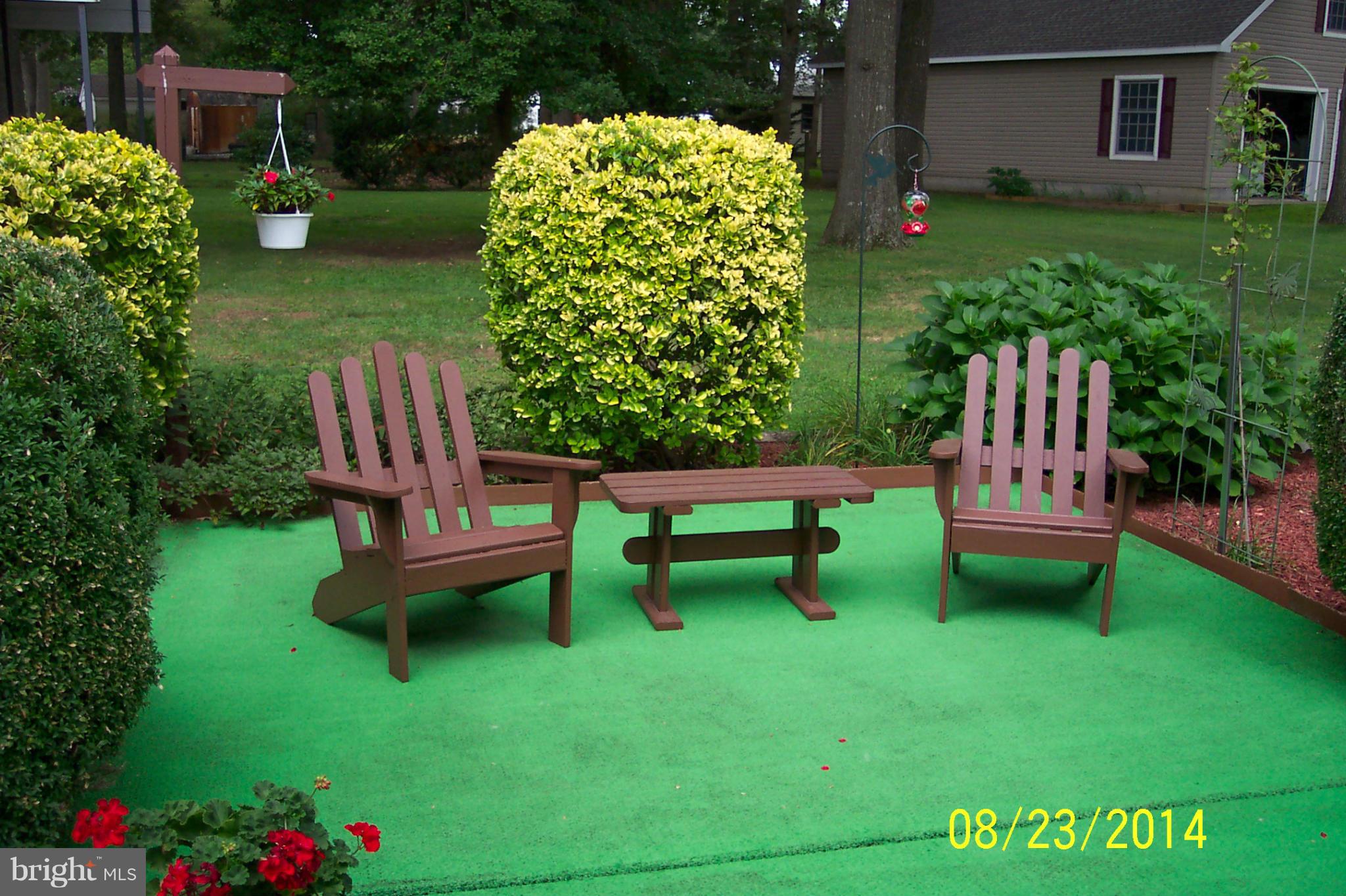 5884 Cloverdale Road Hurlock, MD 21643 - Photo 8 of 26 a view of a chairs in a backyard