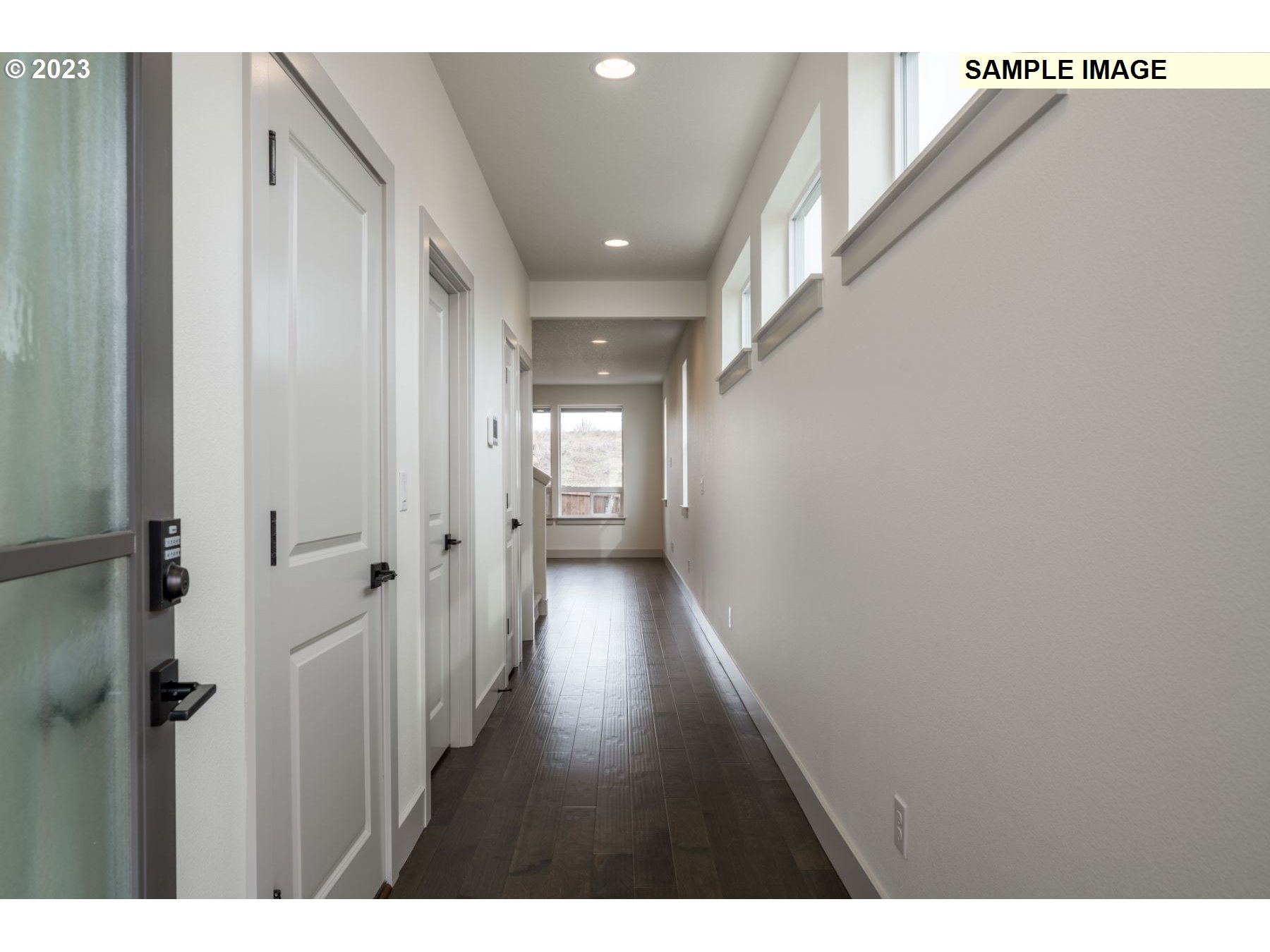 1016 Northwest 178th Street Ridgefield, WA 98642 - Photo 3 of 13 a view of hallway with wooden floor
