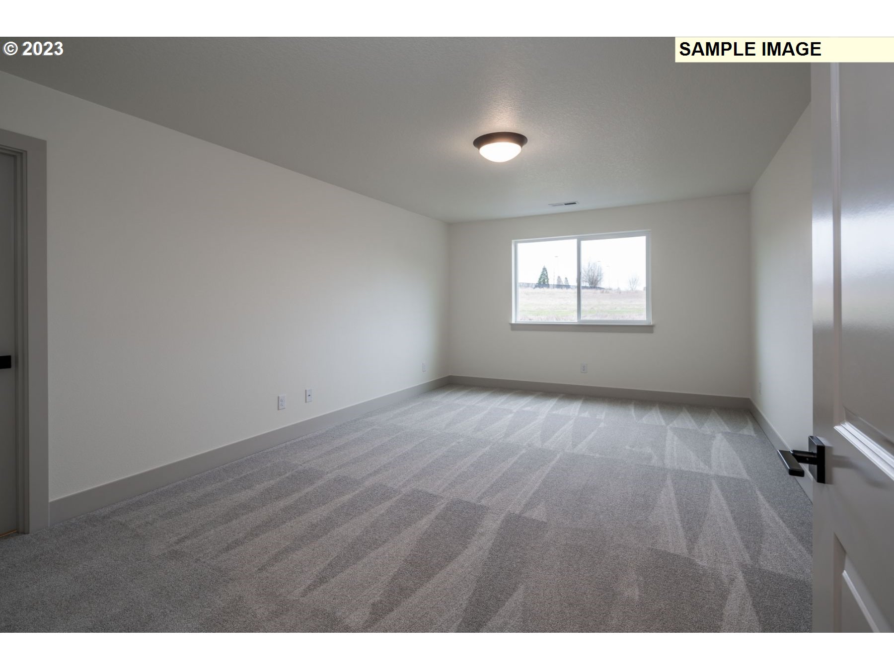 1016 Northwest 178th Street Ridgefield, WA 98642 - Photo 8 of 13 a view of an empty room with a window