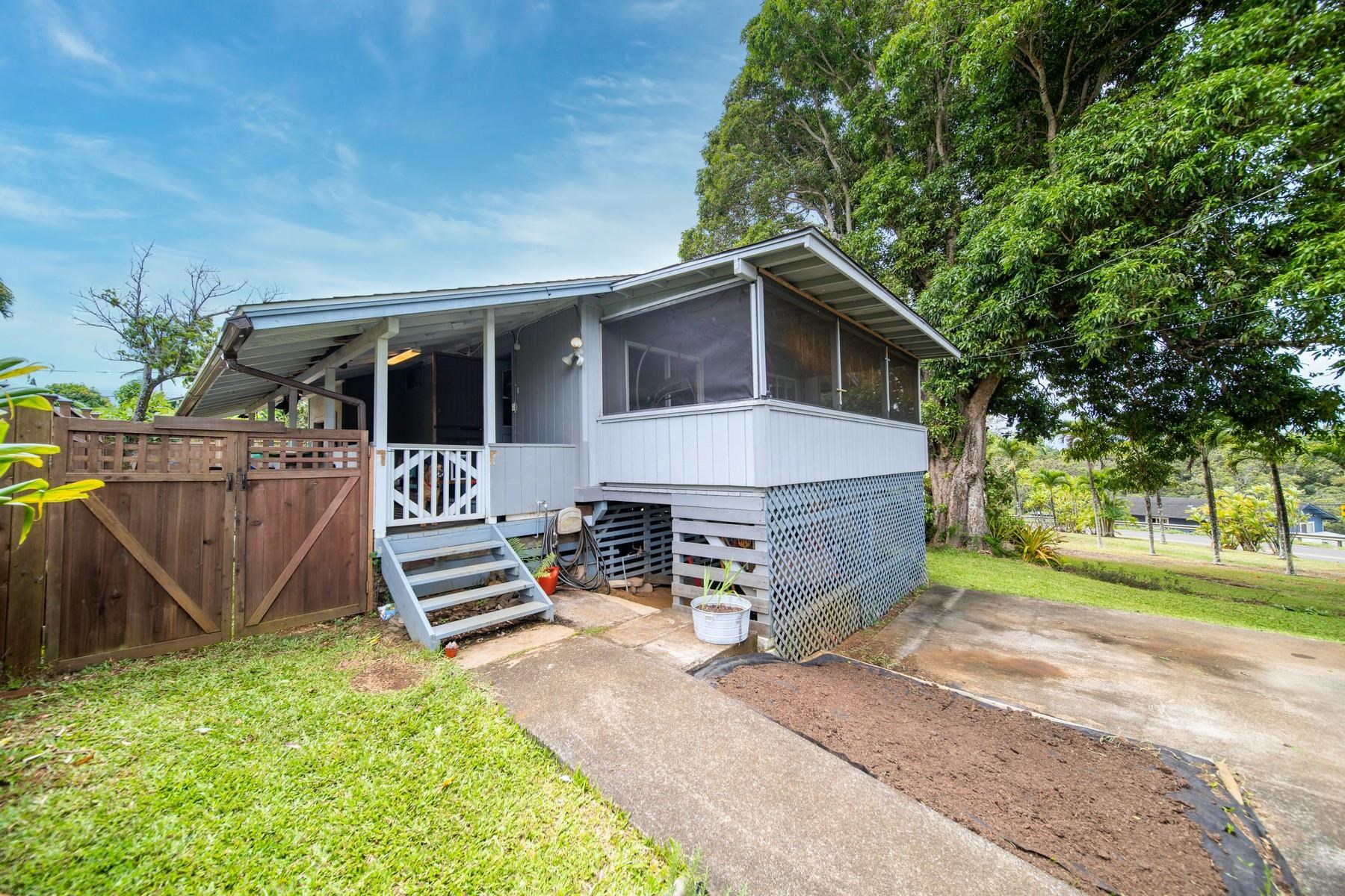 1632 Haiku Road Haiku, HI 96708 - Photo 11 of 27 a front view of a house with a yard