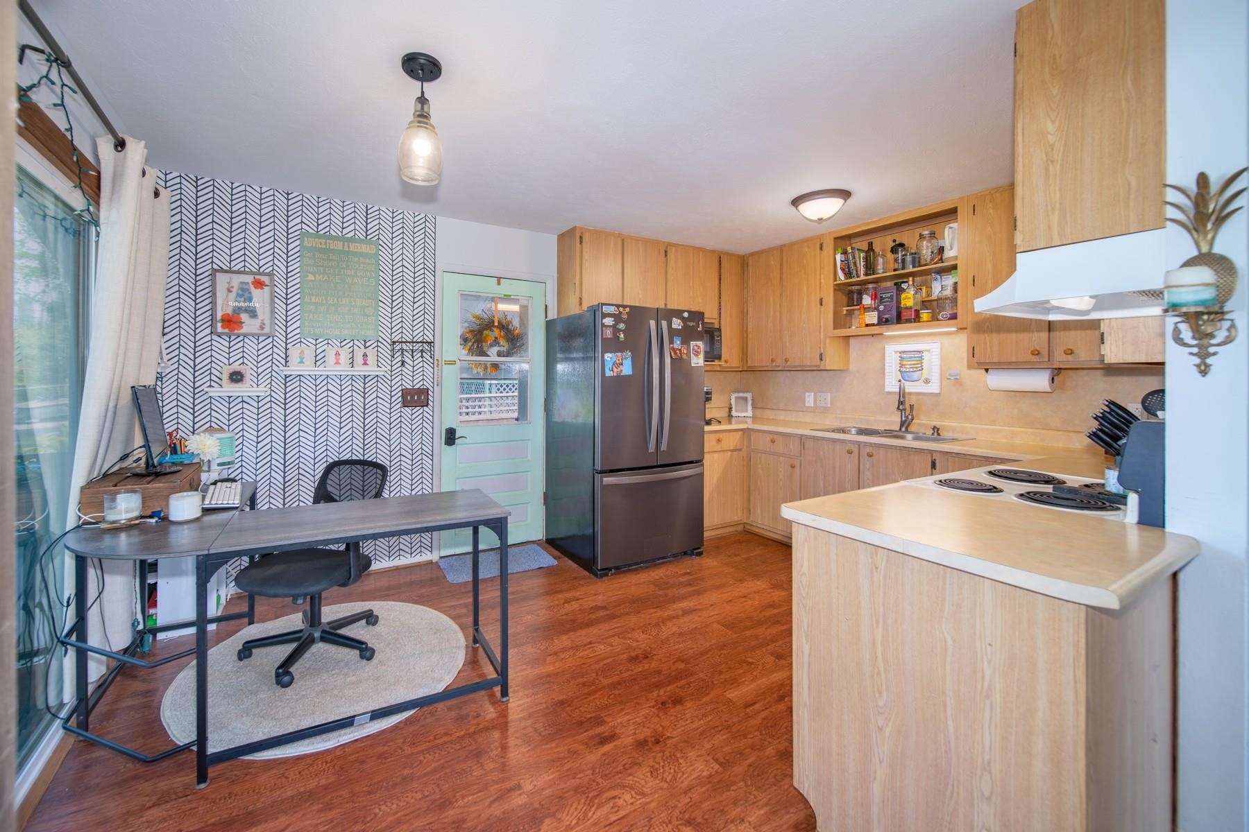 1632 Haiku Road Haiku, HI 96708 - Photo 5 of 27 a kitchen with stainless steel appliances granite countertop a sink stove and refrigerator