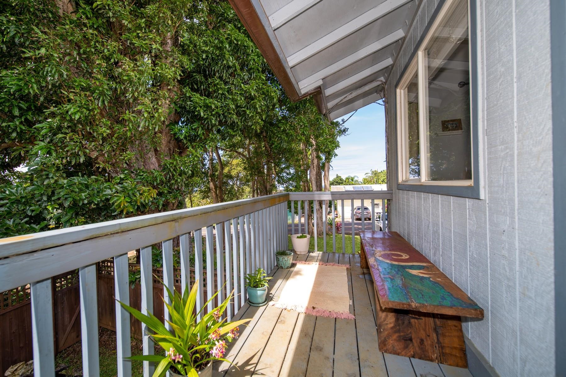 1632 Haiku Road Haiku, HI 96708 - Photo 8 of 27 a balcony with wooden floor and outdoor space
