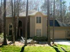 12412 Whartons Way Raleigh, NC 27613 - Photo 1 of 1 a backyard of a house with yard and outdoor seating