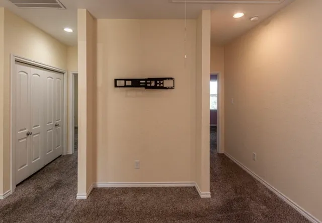 a view of a hallway with closet